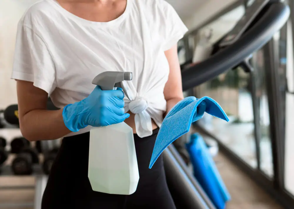 image of a woman wearing white shirt and wearing cleaning implements