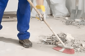 Sweeping floors for construction debris and dust on construction site in Dallas - Fort Worth TX
