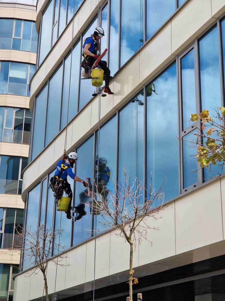 window cleaners cleaning high rise building