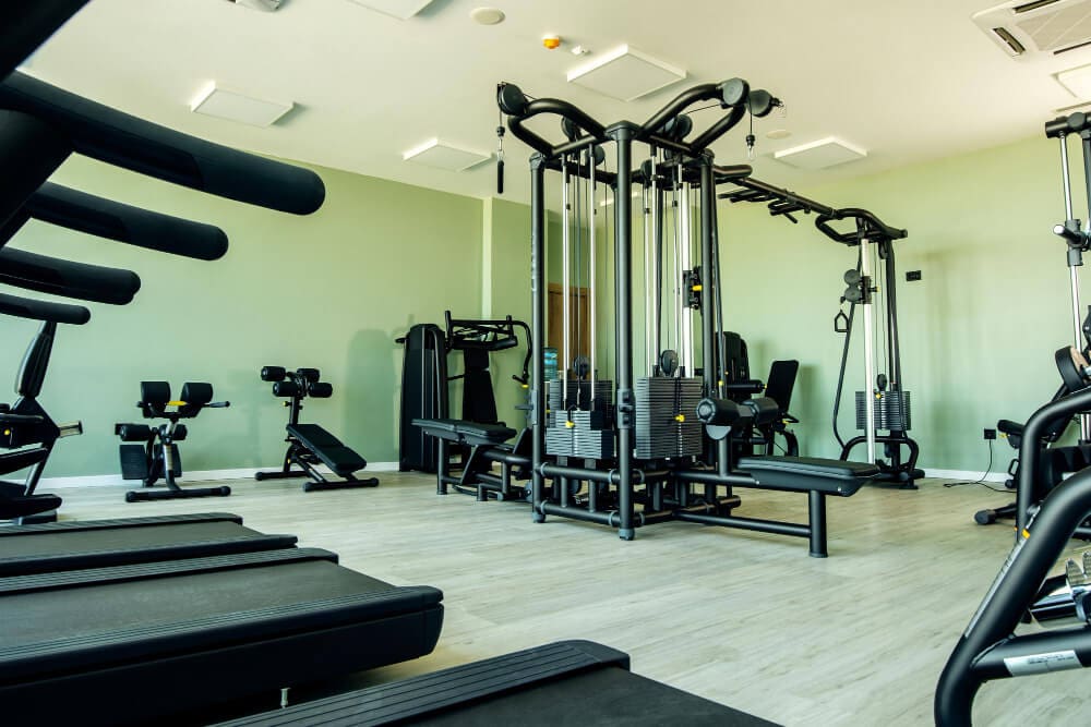 view of gym equipment in a well-lit facility