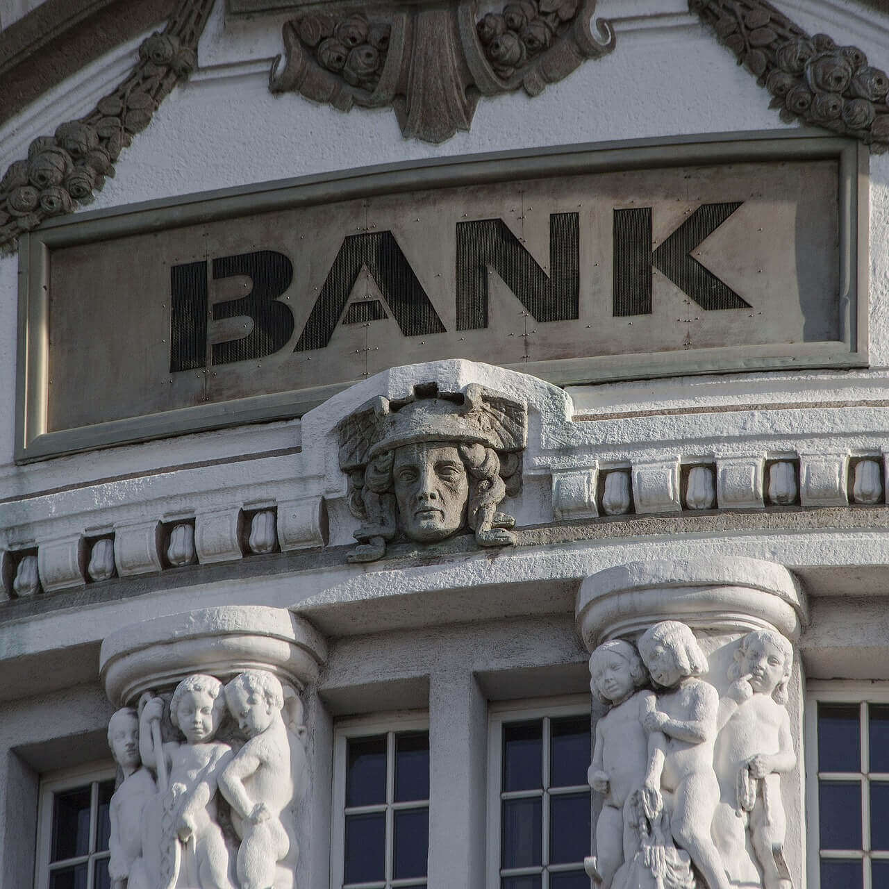 exterior of a bank with the text "bank" on it exterior of a bank with the text "bank" on it