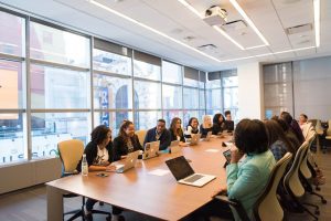 people discussing in a conference room, perspective view