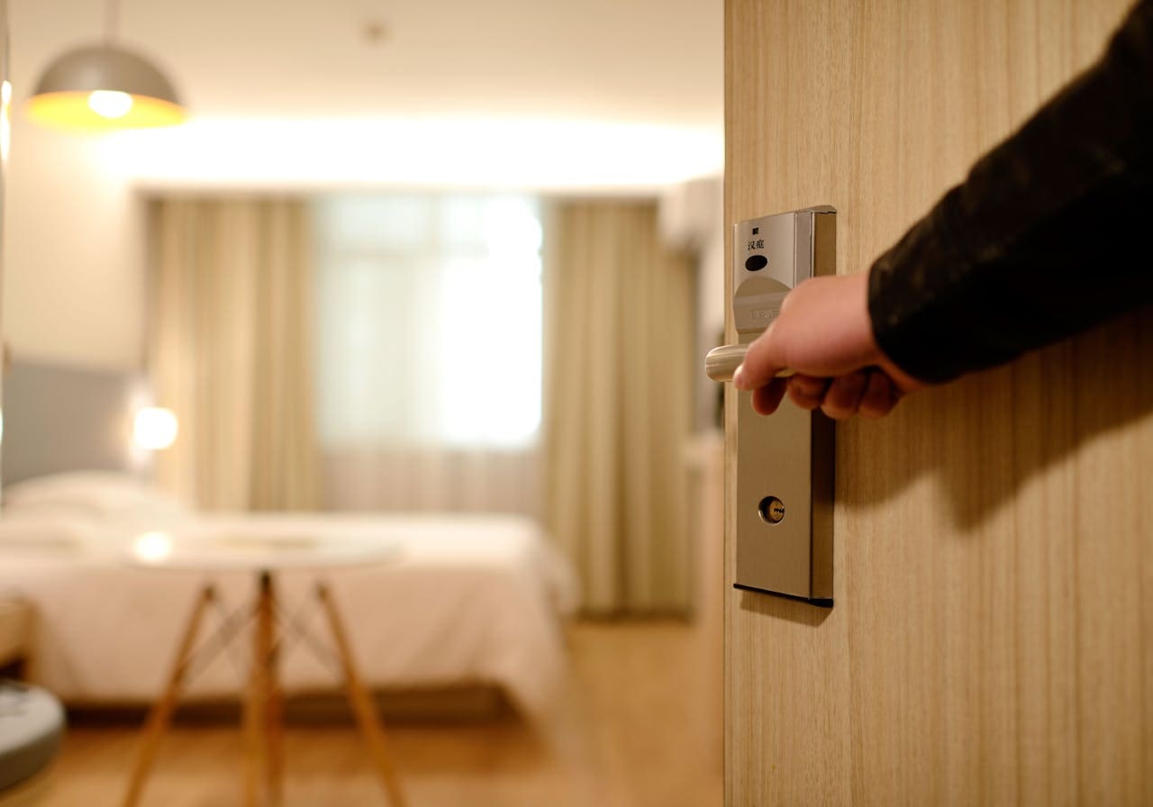 man entering hotel room