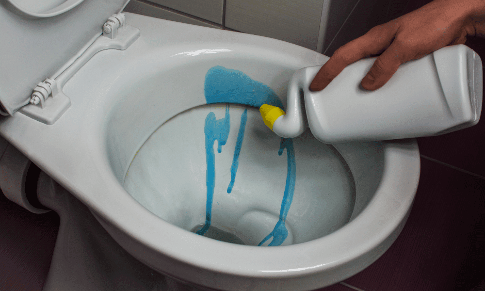 pouring blue toilet bowl cleaning solution (unlabeled)