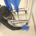 Detailed floor cleaning around waste bins in Dallas Hospital