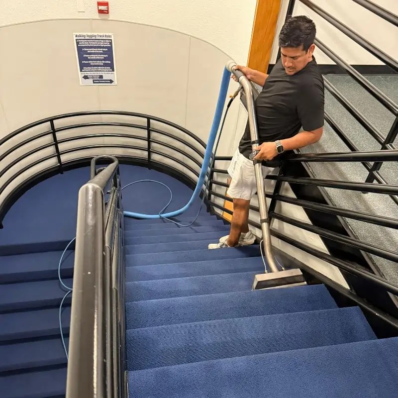 Carpet vacuuming on staircase in office building in Arlington