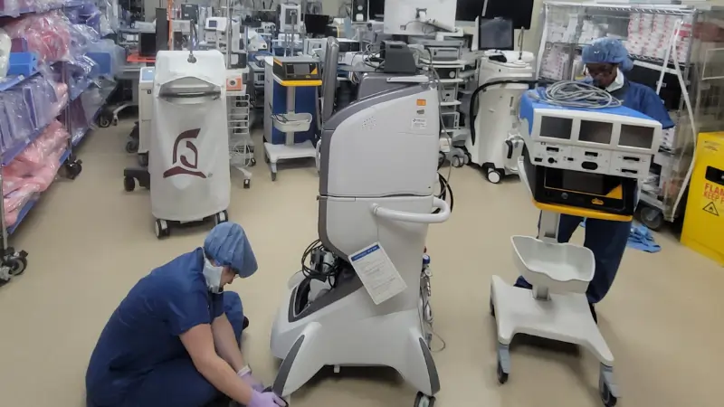 Medical equipment cleaning in Dallas hospital - crew cleaning IV poles and medical carts