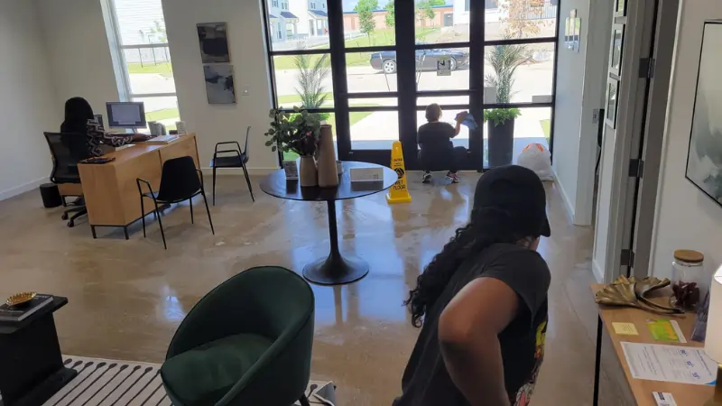Office cleaning - crew cleaning floor and windows in office building in Arlington TX