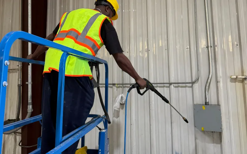 Pressure washing aluminum wall panels inside 75,000 sq ft Garland TX Warehouse