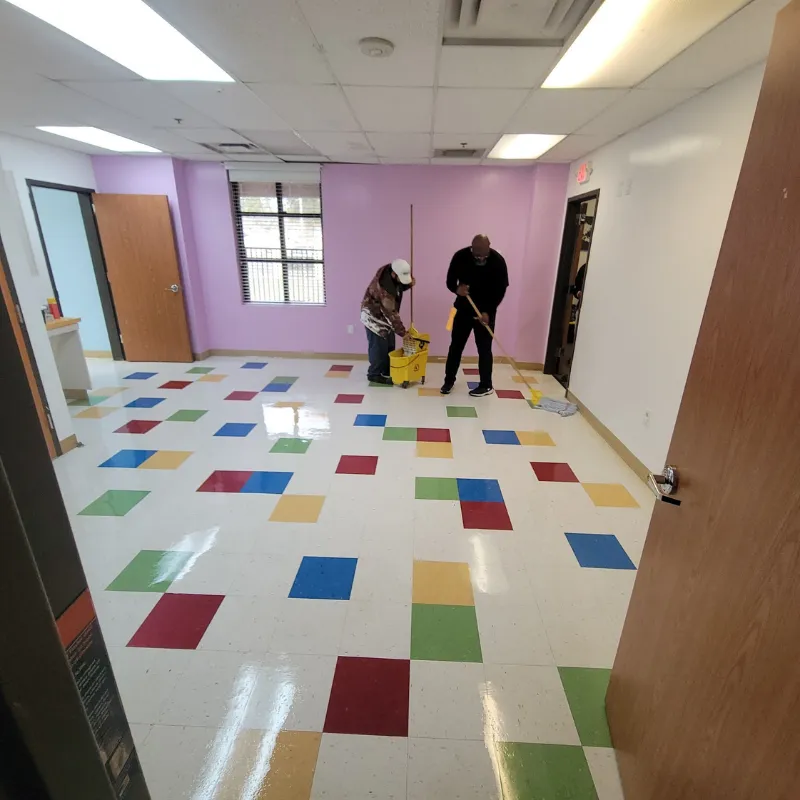 Sweeping and mopping VCT floors in private school facility in Lancaster TX